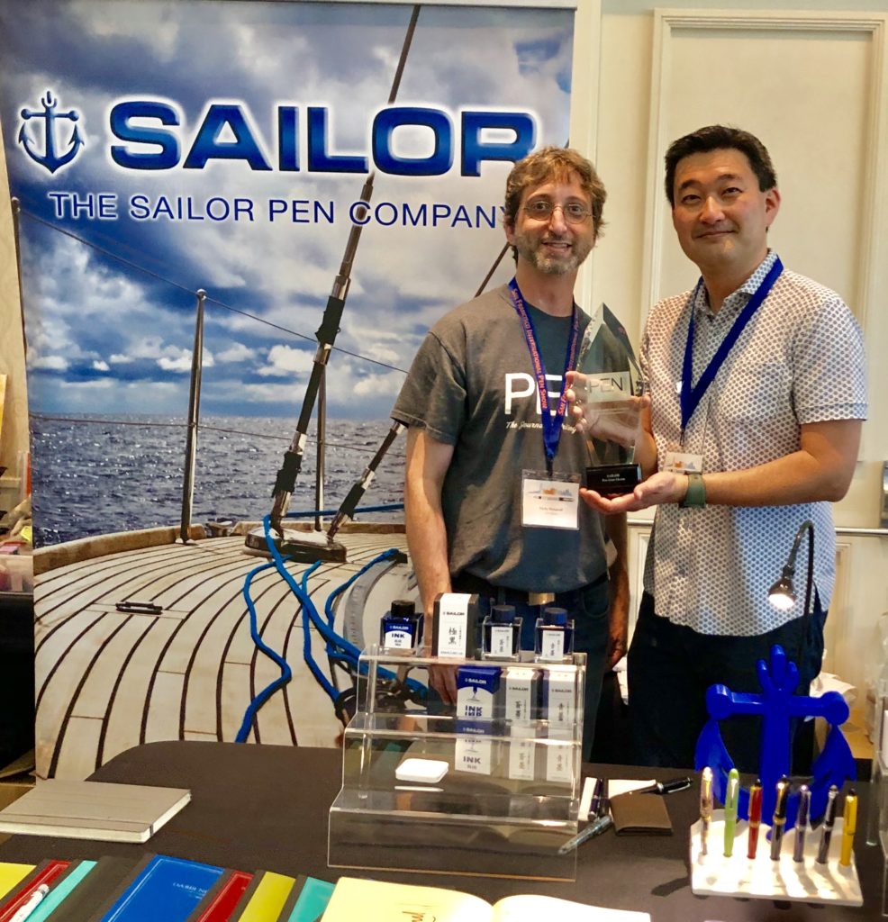 Pen World : Nicky Pessaroff presents Sailor distributor Don Takemura with Sailor’s 2019 RCA awards.